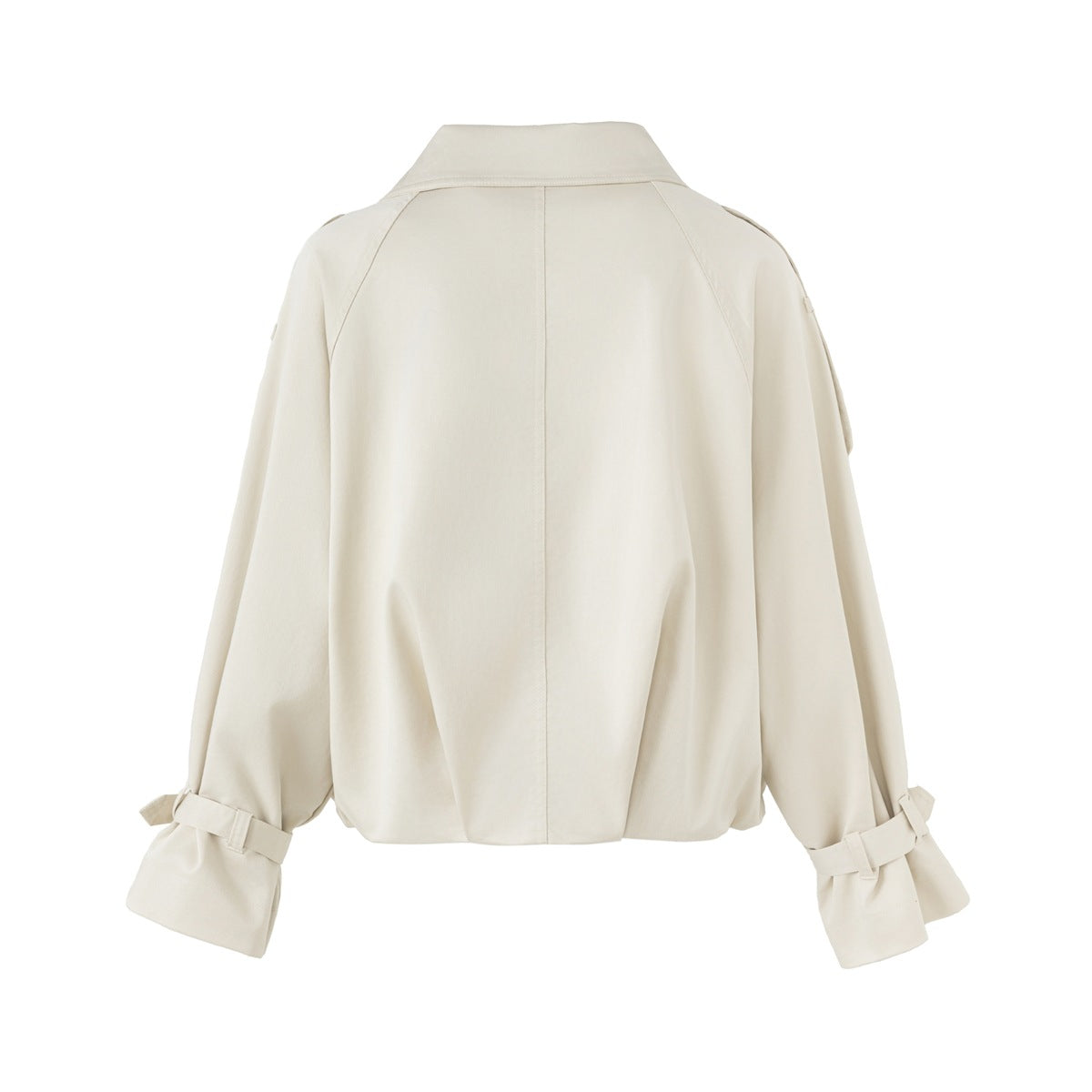 Back view of a cream jacket shown flat against a white background, with a collar, raglan seams, and cuff straps.