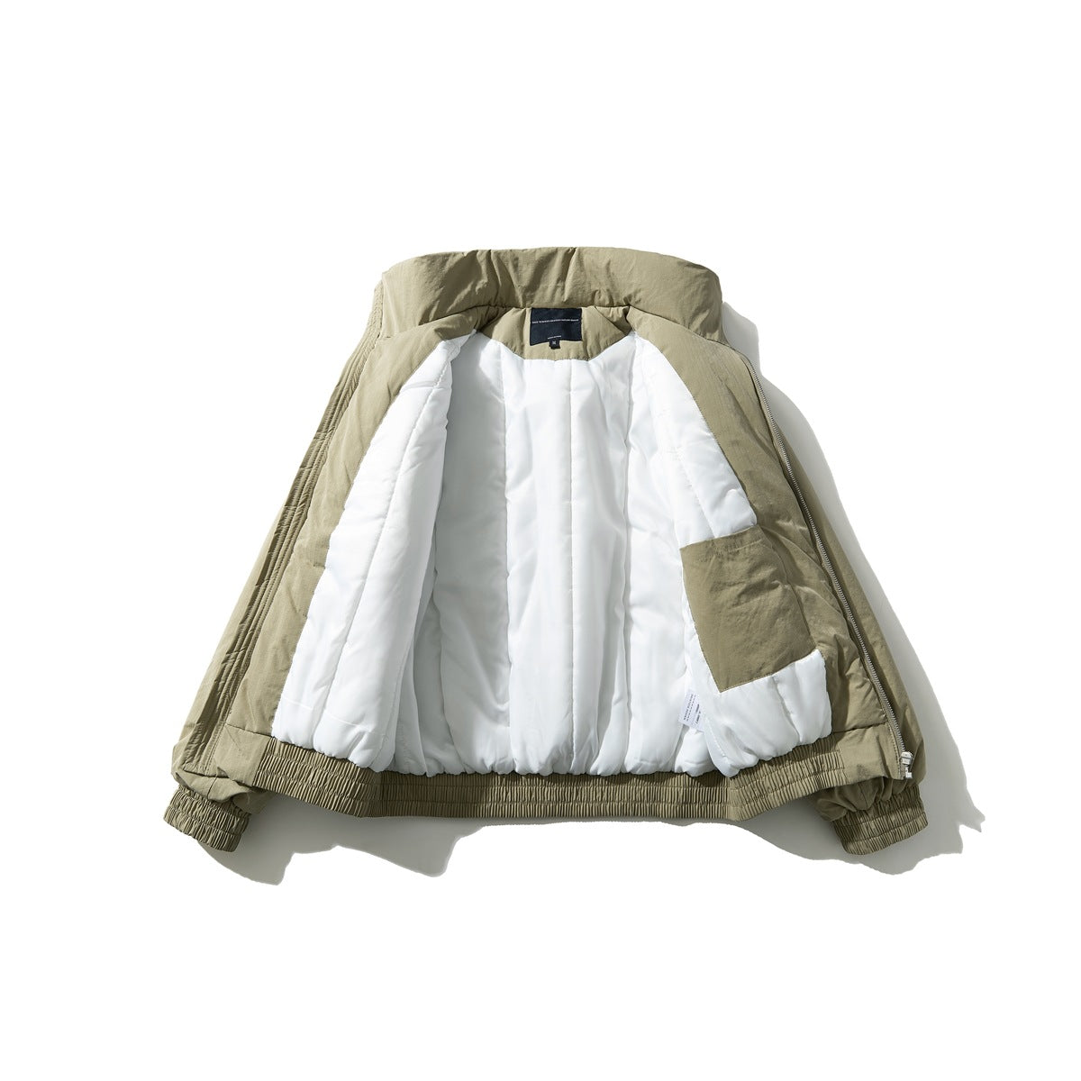 Khaki jacket opened flat to show its white quilted lining, inner pocket, zipper, and elastic hem and cuffs.
