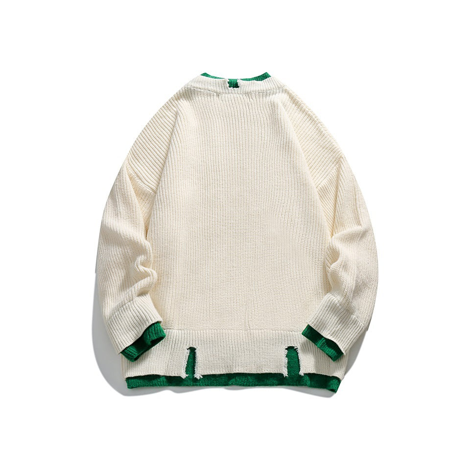 Back view of an ivory rib-knit sweater with green trim at the collar, cuffs, and split hem, laid flat on white.