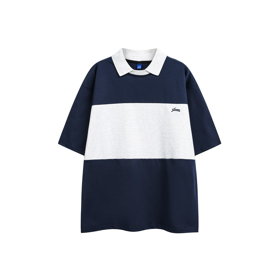 Navy short-sleeve top with heather gray collar and wide gray chest panel, flat front view
