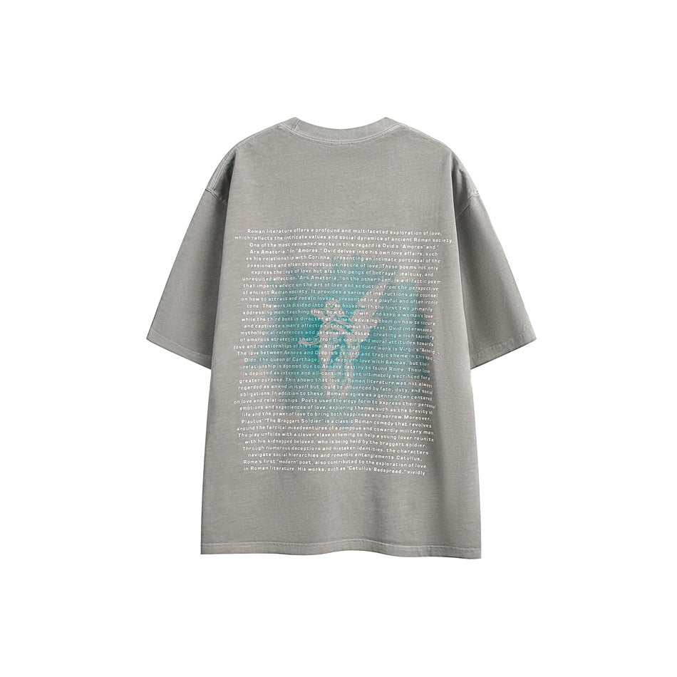 Back view of a light gray washed oversized T-shirt with a large block of small white text printed on the back.