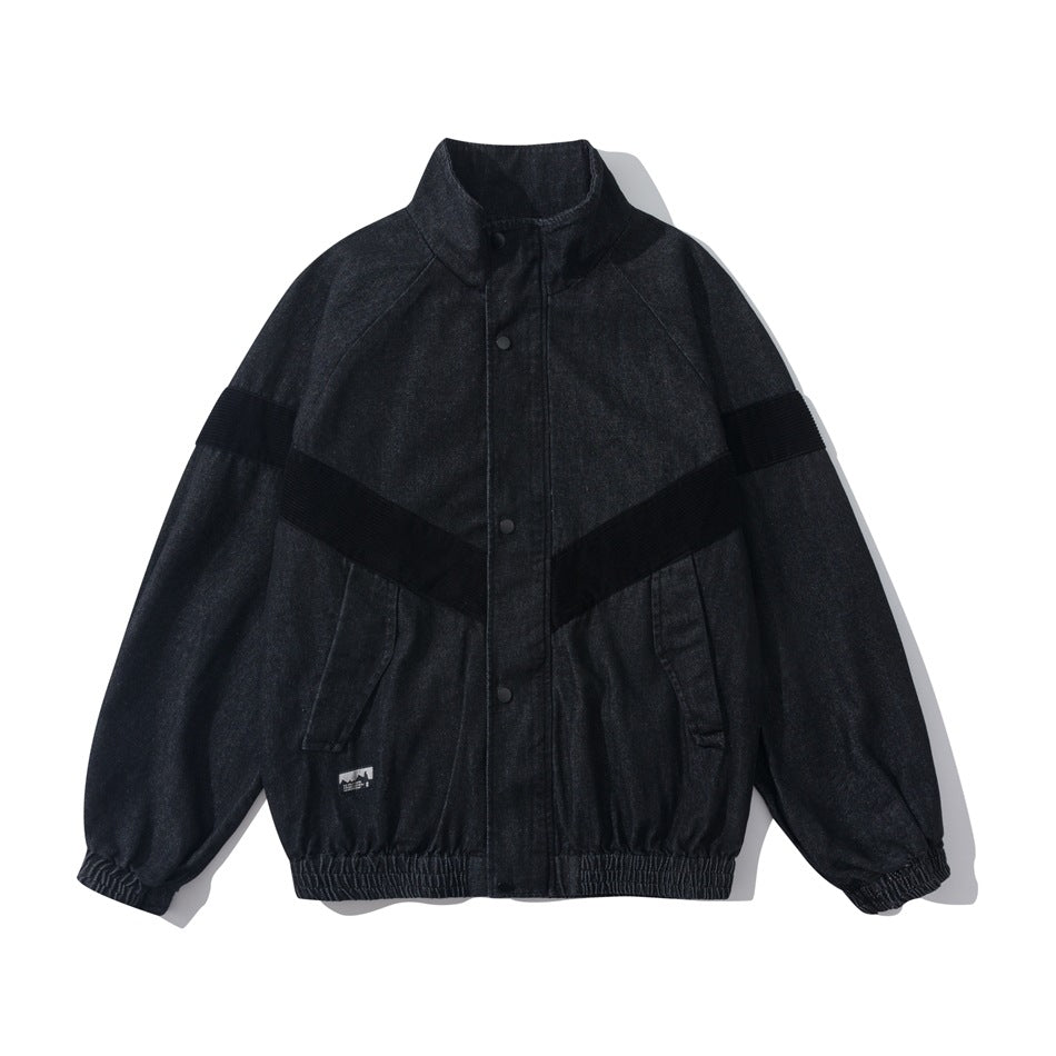 Black denim-look stand-collar jacket with snap front, black ribbed chevron panels, elastic cuffs and hem, flat lay front view