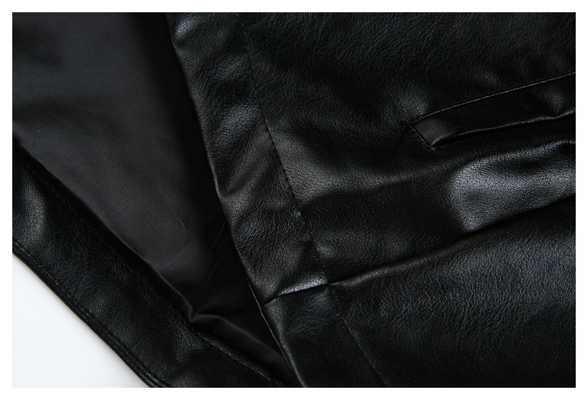 Close-up of the black jacket's lining, seams, and pocket opening.