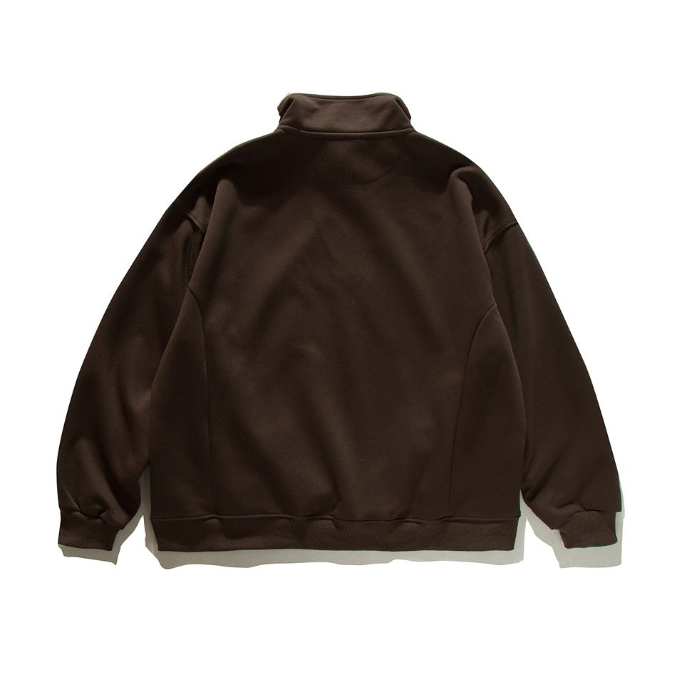 Back view of a dark brown high-collar sweatshirt with long sleeves and ribbed cuffs and hem.