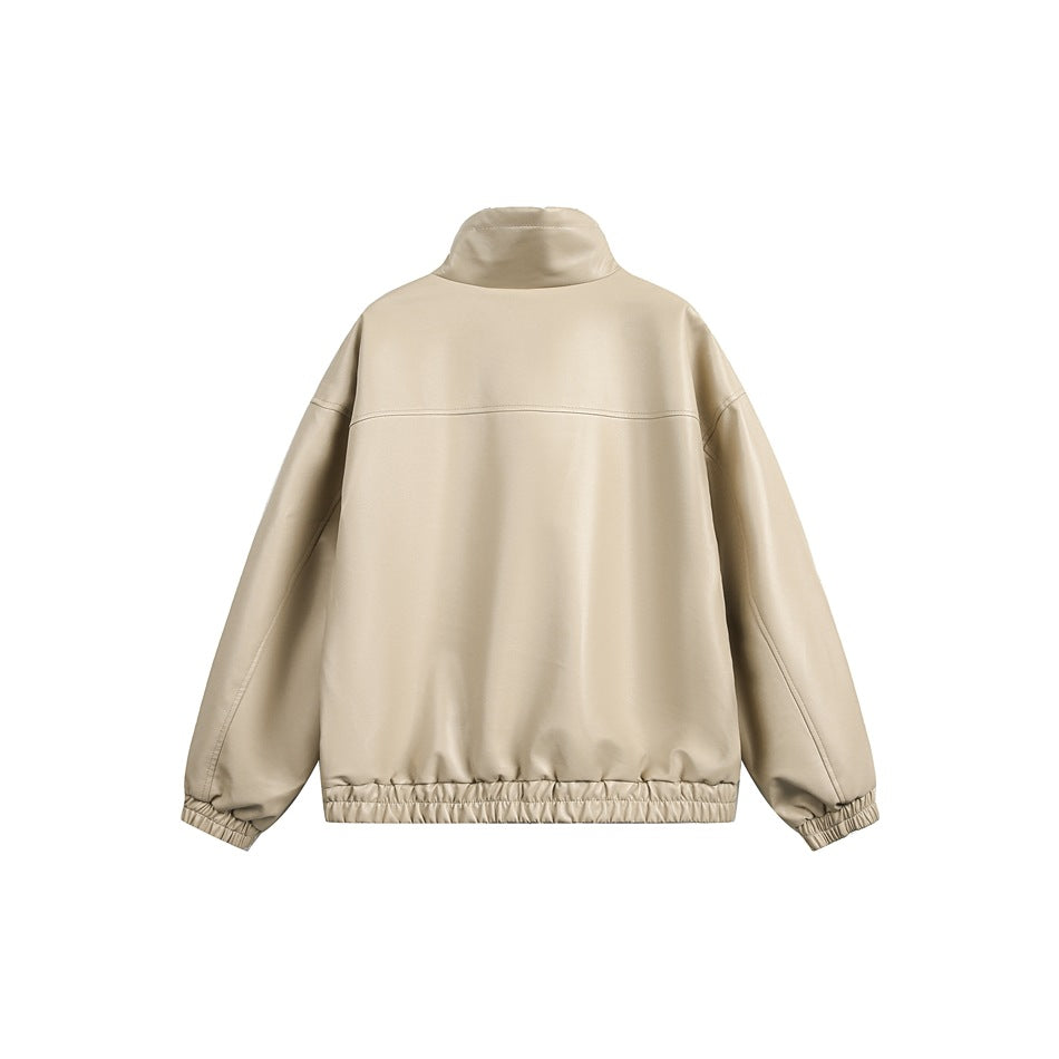Back view of a beige jacket with a raised collar, dropped shoulders, long sleeves, and an elasticated hem and cuffs.