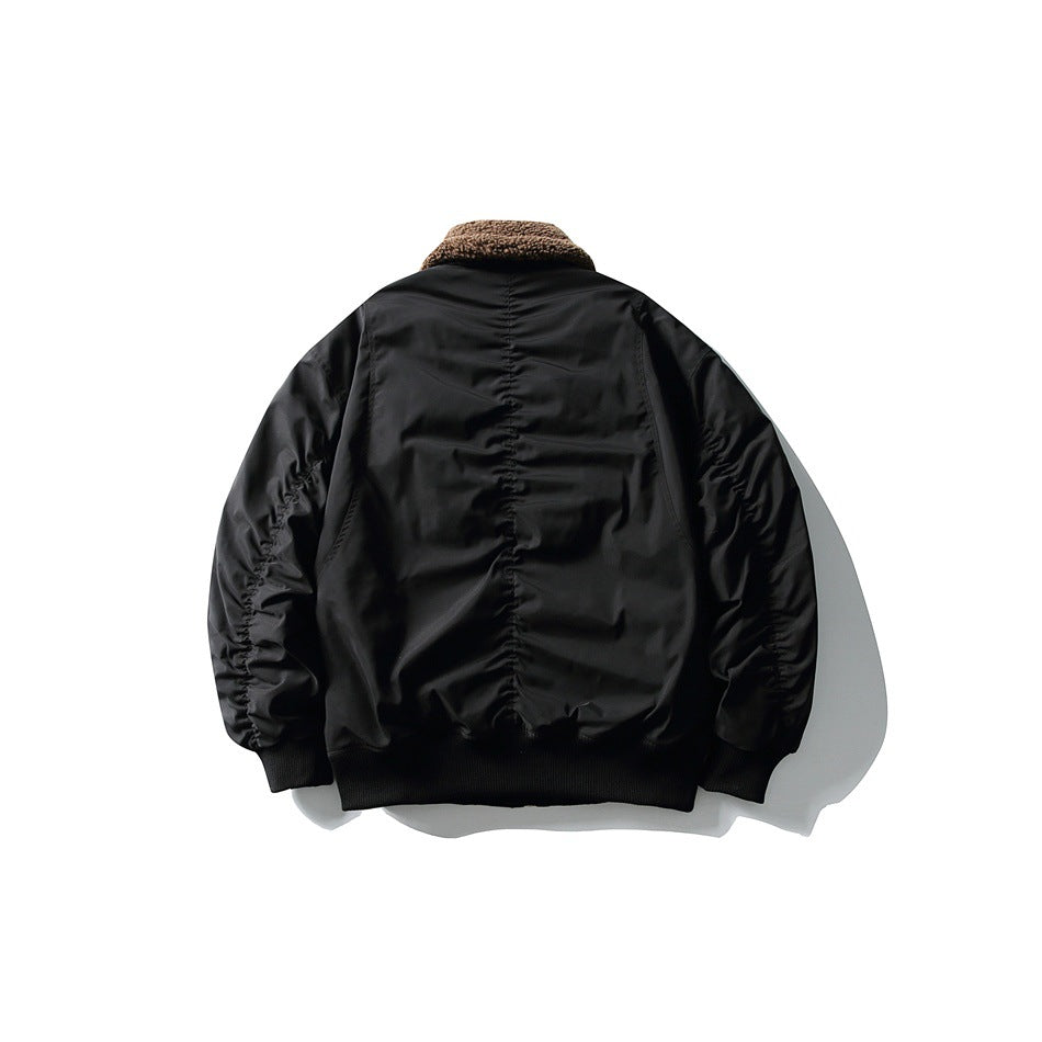 Back view of black bomber jacket with ruched center back panel, ruched sleeves, brown collar and ribbed hem