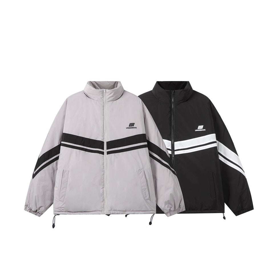 Two oversized zip jackets shown side by side in light gray and black, each with contrasting chevron stripes.