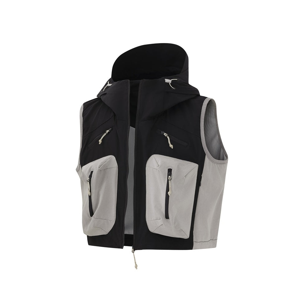 Front view of a black hooded utility vest with light gray panels and multiple zippered pockets.
