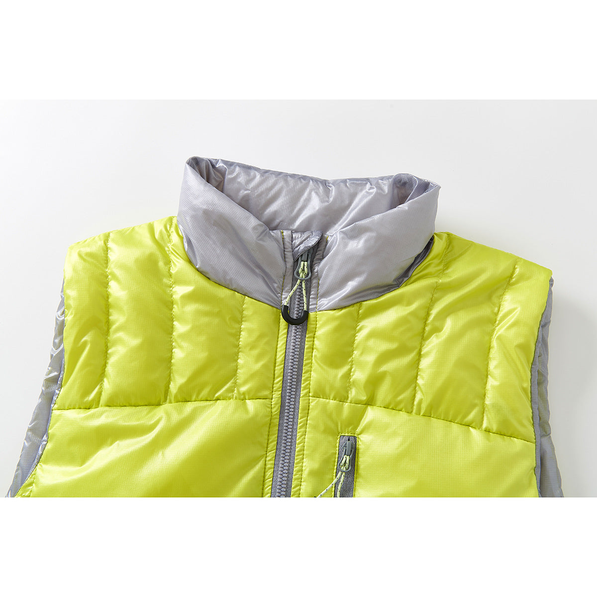 Close-up of a lime-yellow quilted vest with a light gray stand collar, front zipper, and chest pocket.