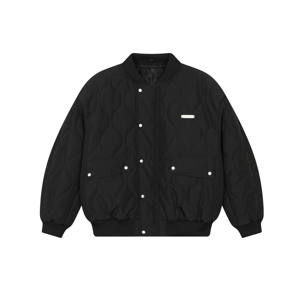 Black quilted bomber jacket with ribbed collar, snap front, flap pockets and metal chest label, flat front view