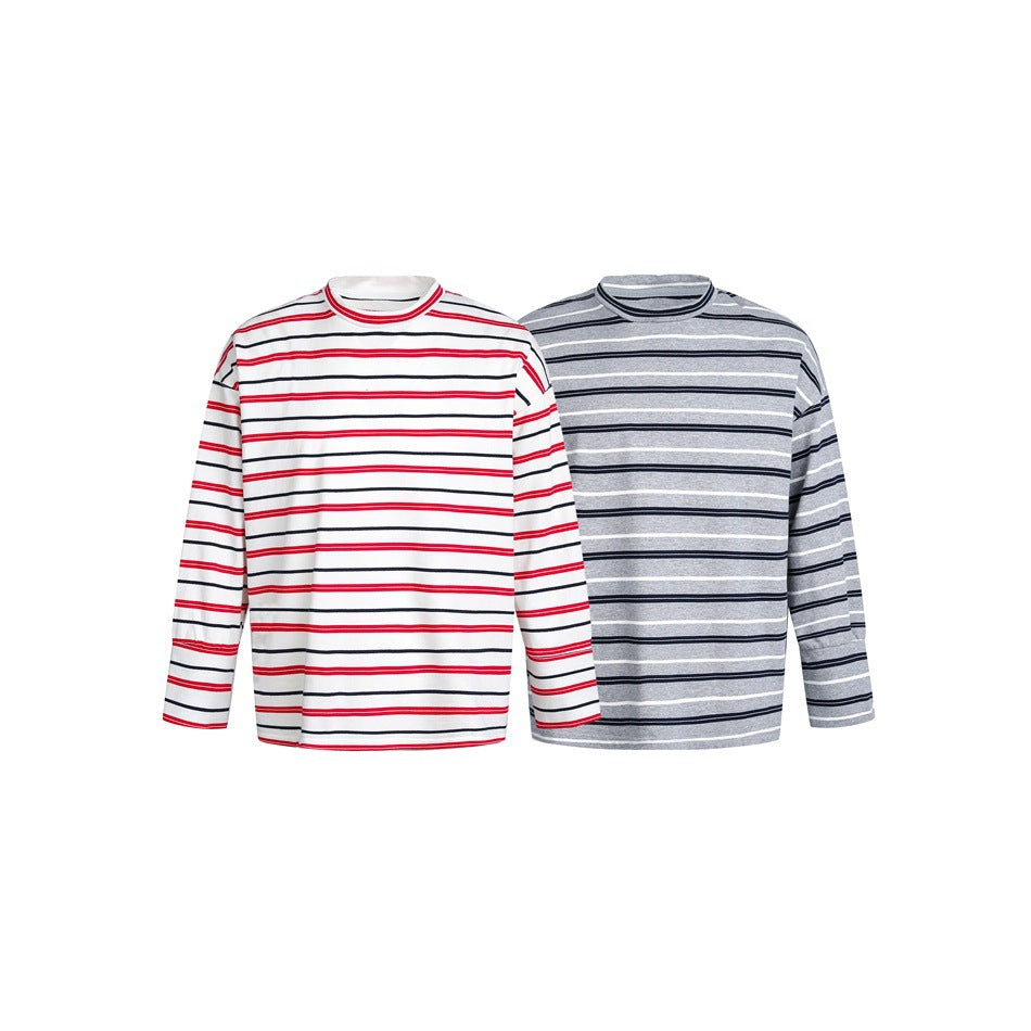 Two long-sleeve crewneck shirts shown from the front: white with red and black stripes, and gray with black and white