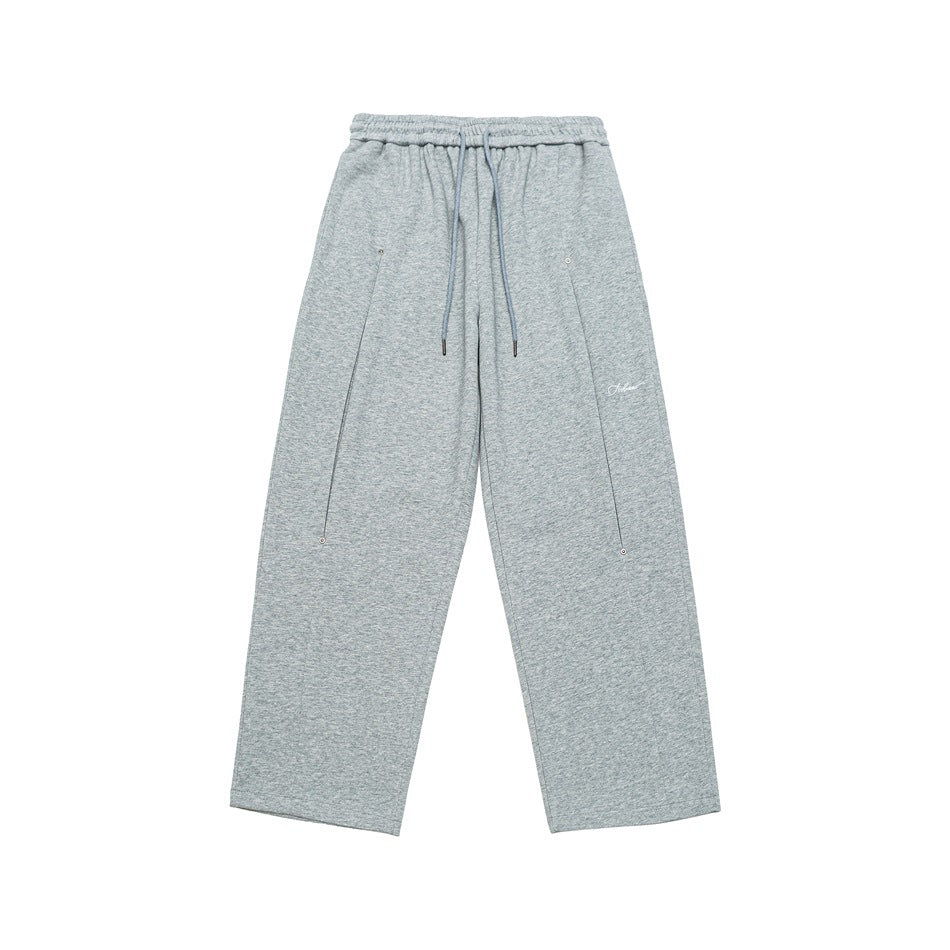 Heather gray wide-leg sweatpants flat lay with drawstring waist, front seams, snap details and small script embroidery