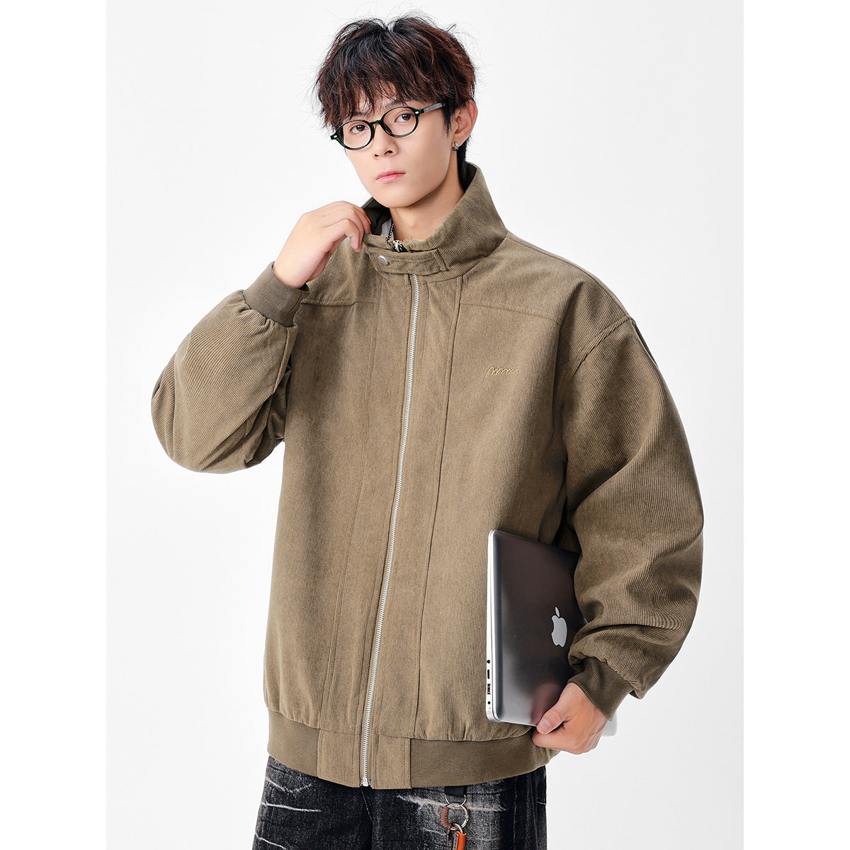 Model wearing a taupe zip-front jacket with a raised collar, oversized sleeves, and ribbed cuffs and hem.