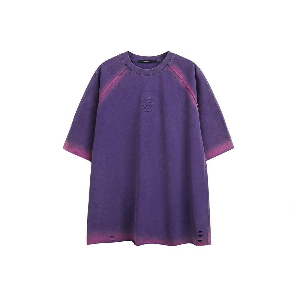 Purple short-sleeve raglan T-shirt with pink gradient edges, embossed chest graphic and small slits at the hem, flat front