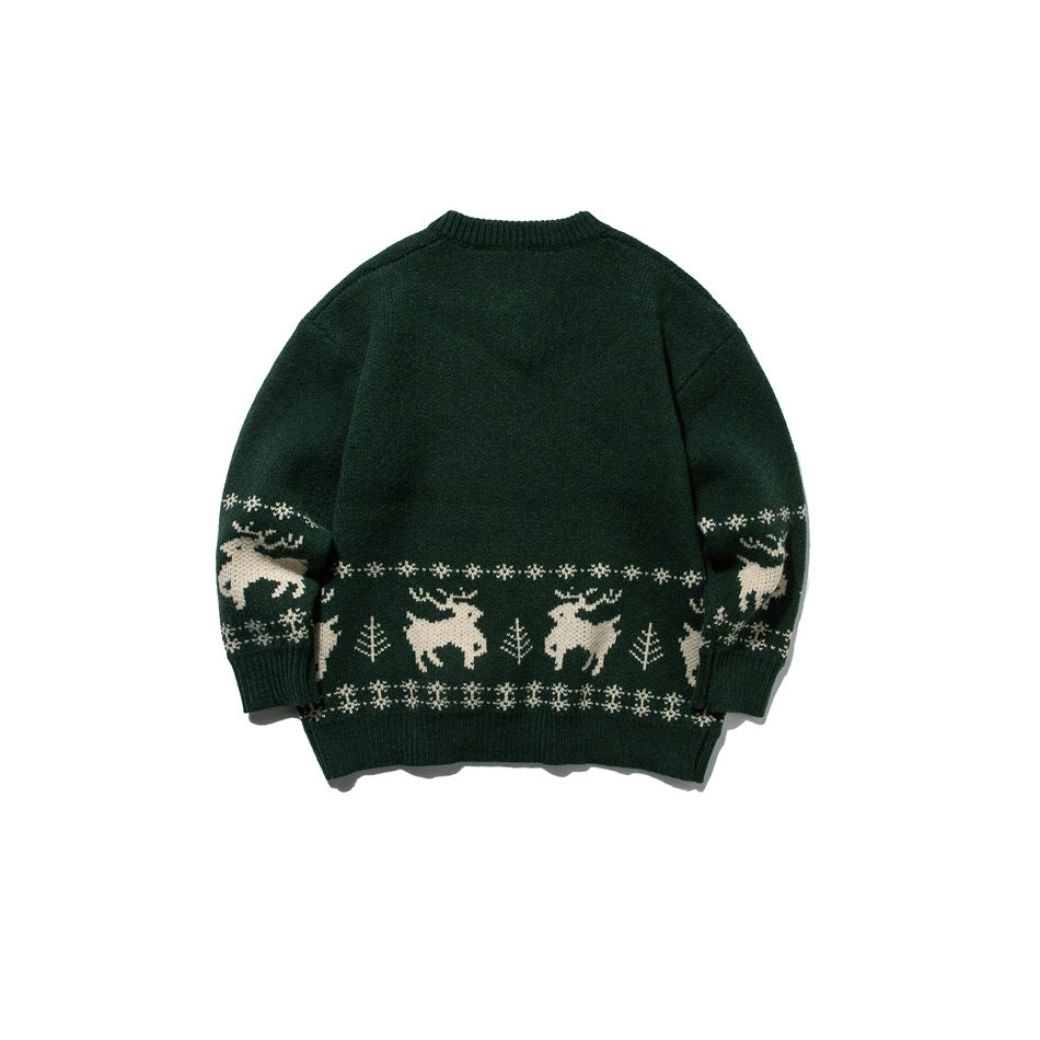 Back view of green knit sweater with cream reindeer, tree and snowflake pattern band across the lower body and sleeves