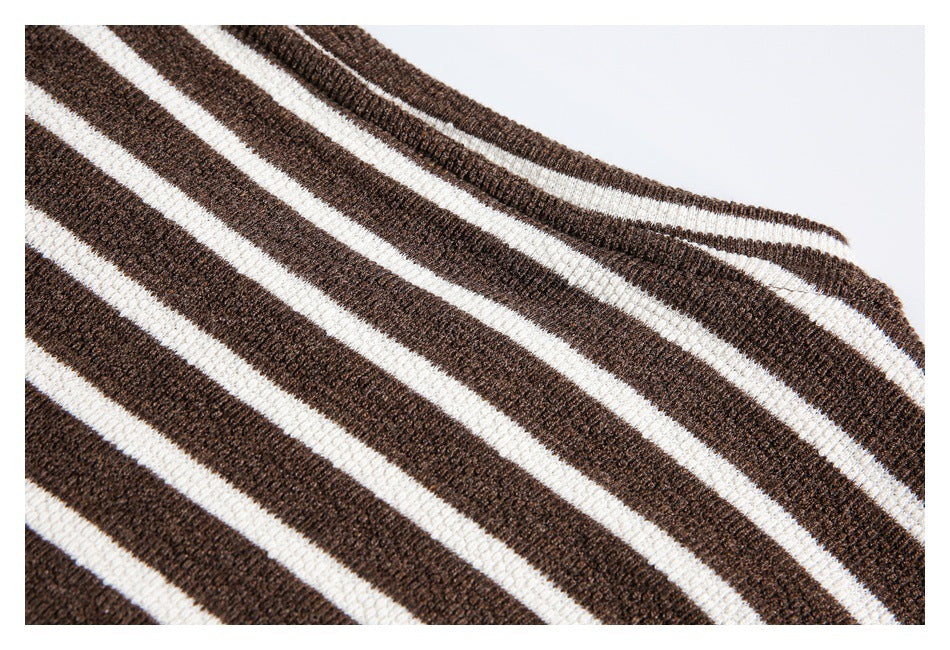 Close-up of the shoulder area and striped knit fabric of a brown-and-cream top.