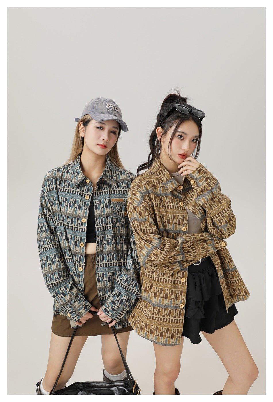 Two models pose in blue and brown geometric-patterned button-up shirts, shown from the waist up.