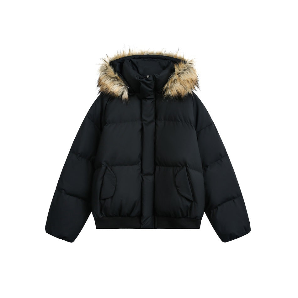 Black puffer jacket with fur-trimmed hood, center placket, flap pockets and ribbed hem, flat front view