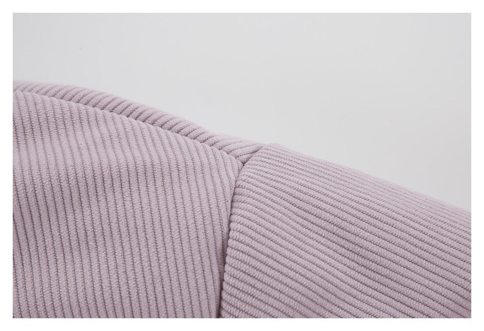 Close-up showing the raised ribbed texture and seam of lilac jacket fabric.