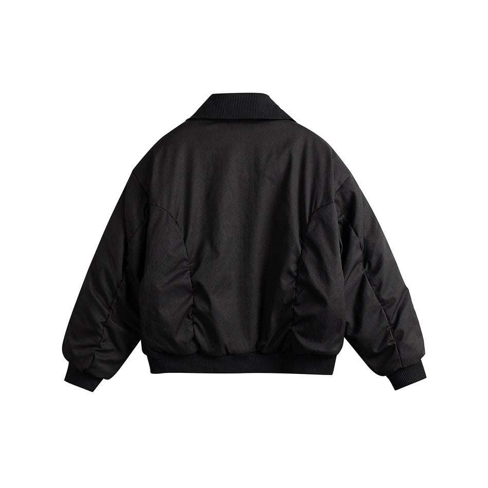 Back view of black padded bomber jacket with ribbed collar, cuffs and hem and curved seam detailing