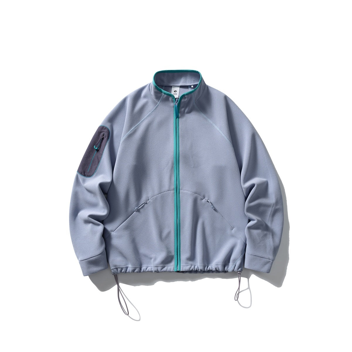 Light blue-lavender waffle-knit zip jacket with teal zipper and collar trim, sleeve pocket and drawcord hem