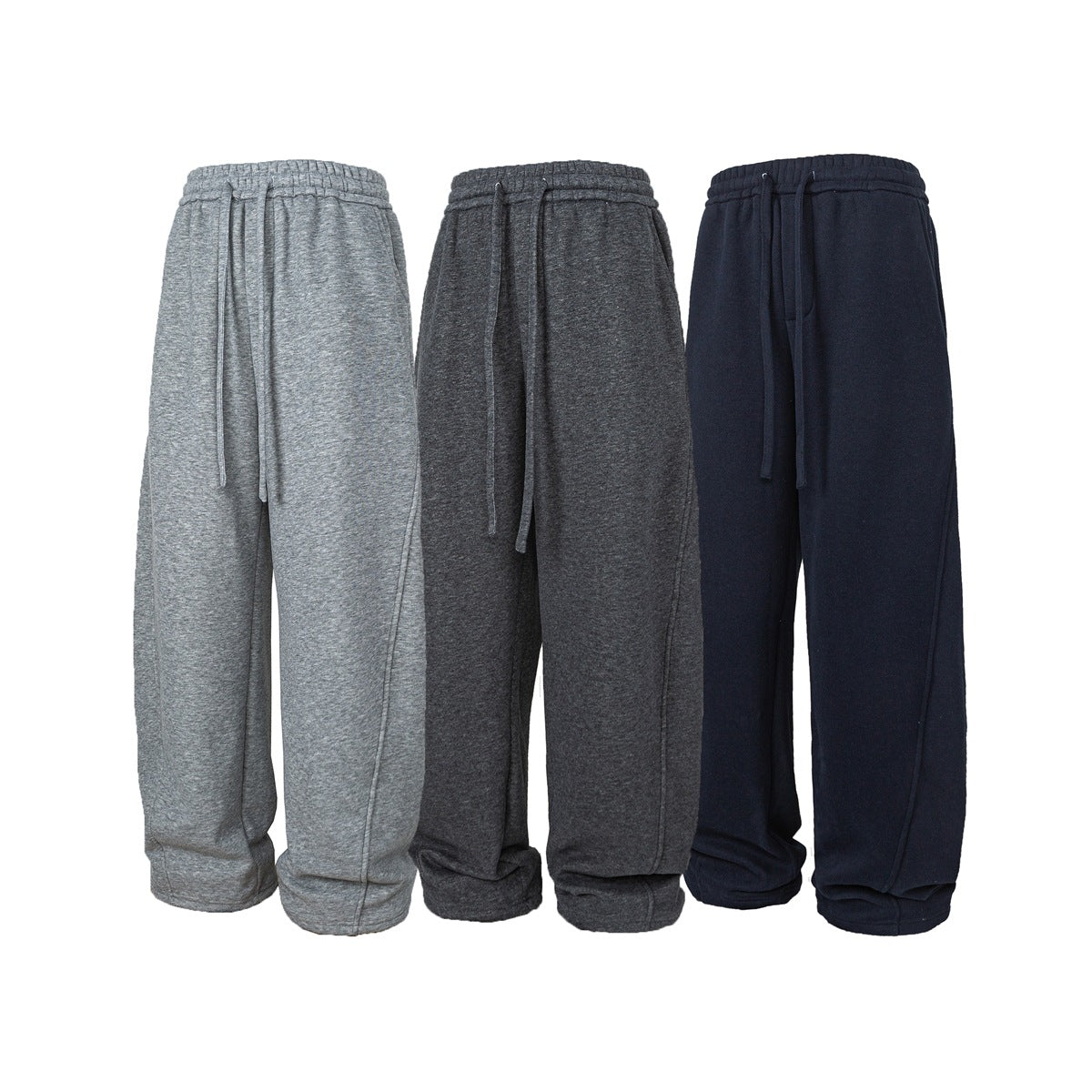 Front view of loose sweatpants with drawstrings in light gray, charcoal, and navy.