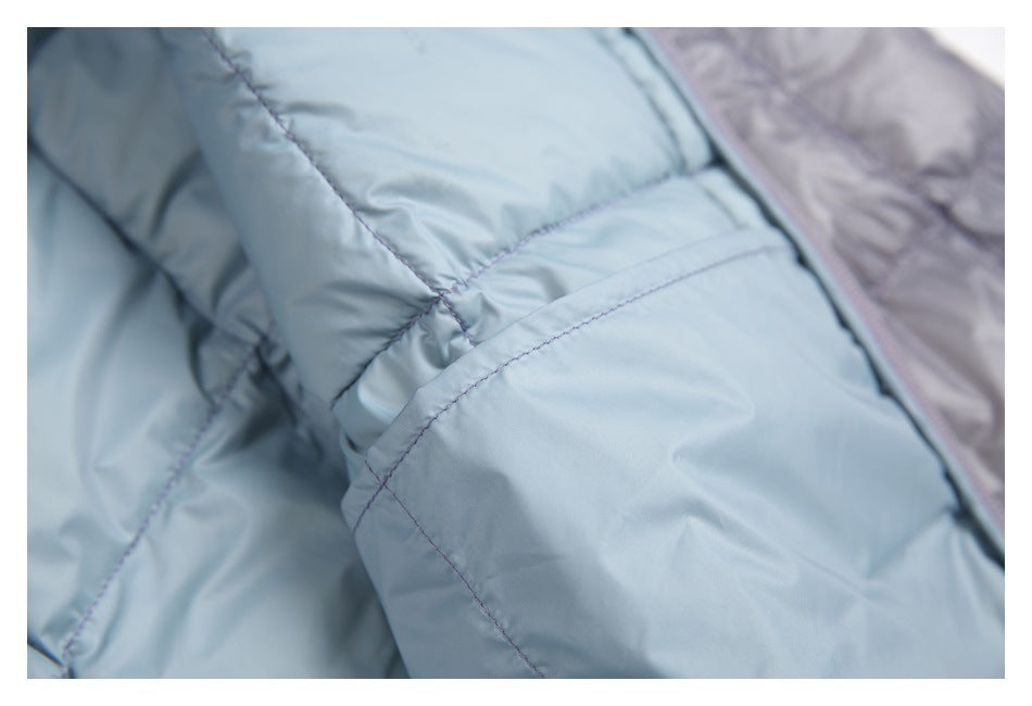 Close-up of stitching on the jacket's pale blue quilted lining.