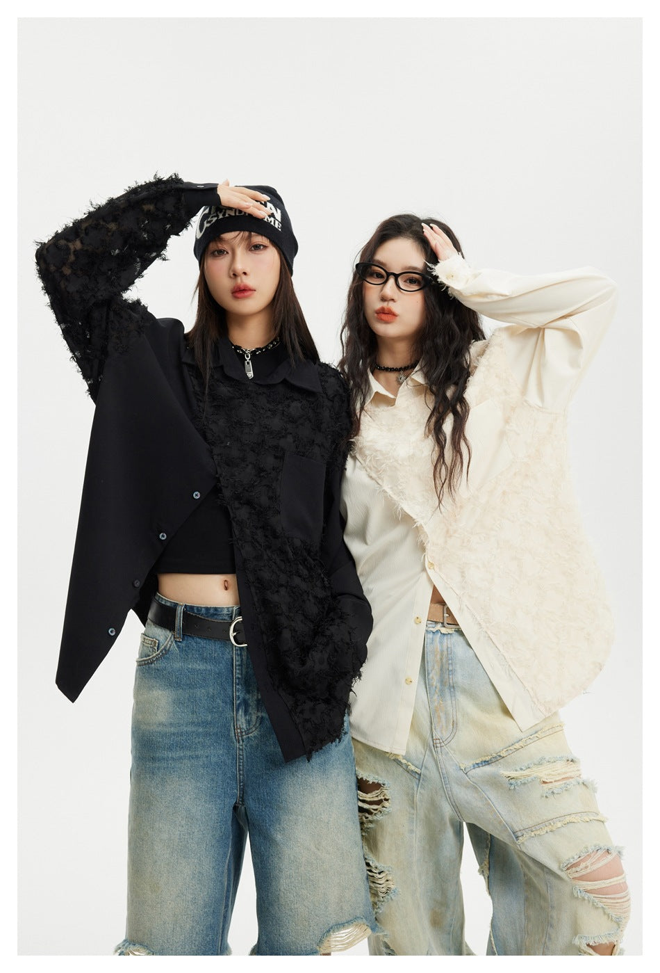 Two models wearing oversized black and ivory shirts with shaggy textured panels and contrasting smooth sections.