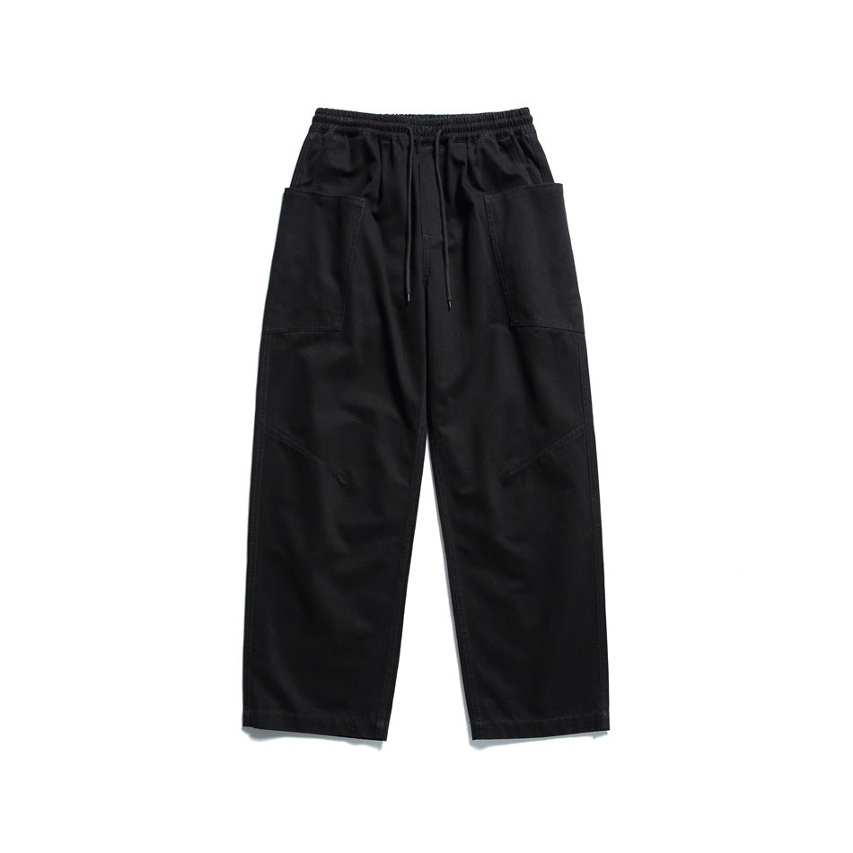 Black wide-leg drawstring pants with large side patch pockets, flat lay front view