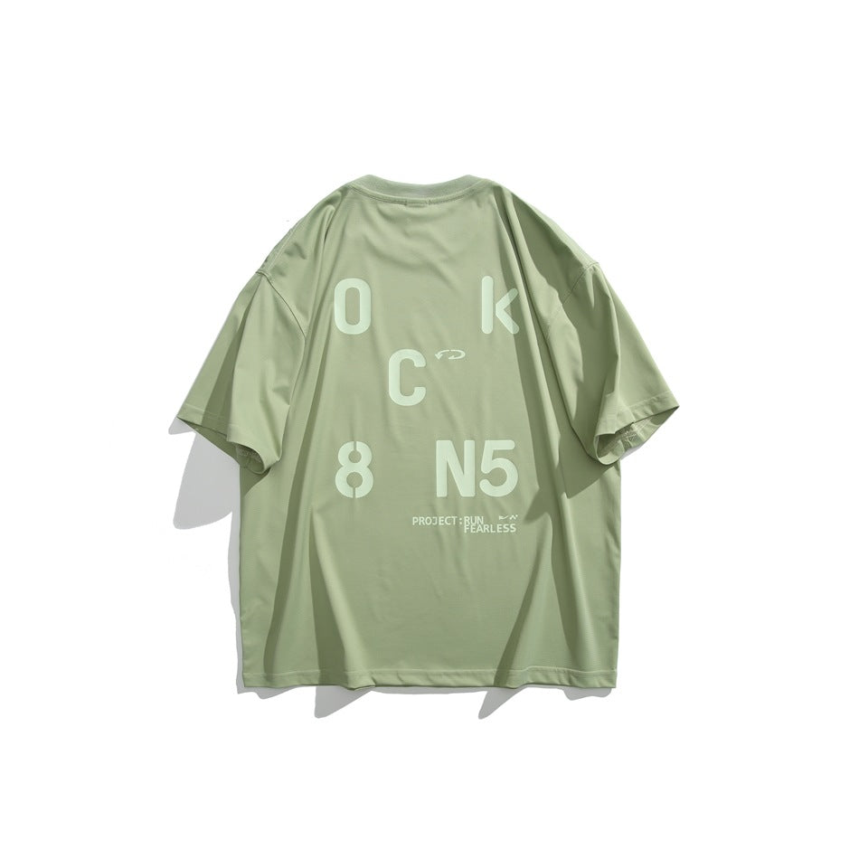 Back of avocado green short-sleeve T-shirt with large light green stencil letter and number graphic