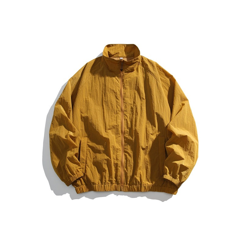 Amber stand-collar zip-front jacket laid flat with raglan sleeves and elastic cuffs