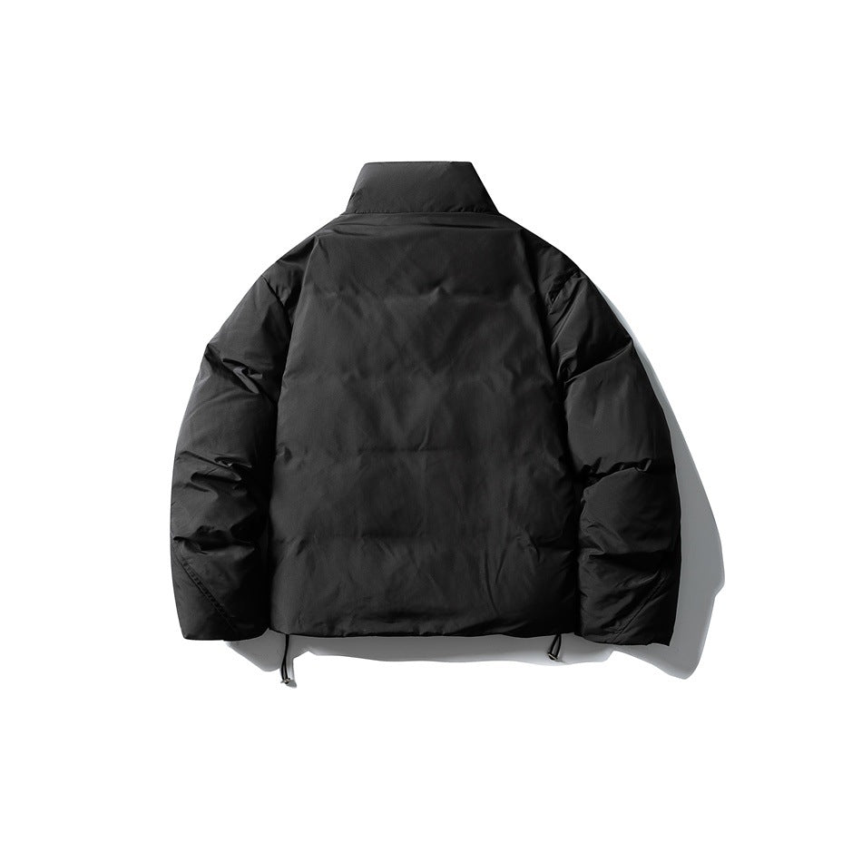 Back view of black quilted puffer jacket with stand collar and hem drawcord toggles, flat lay