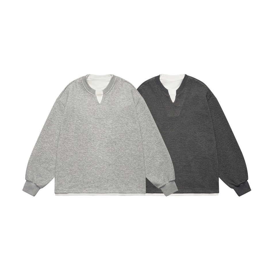 Front view of two long-sleeve sweatshirts in light gray and charcoal, each layered over a white shirt.