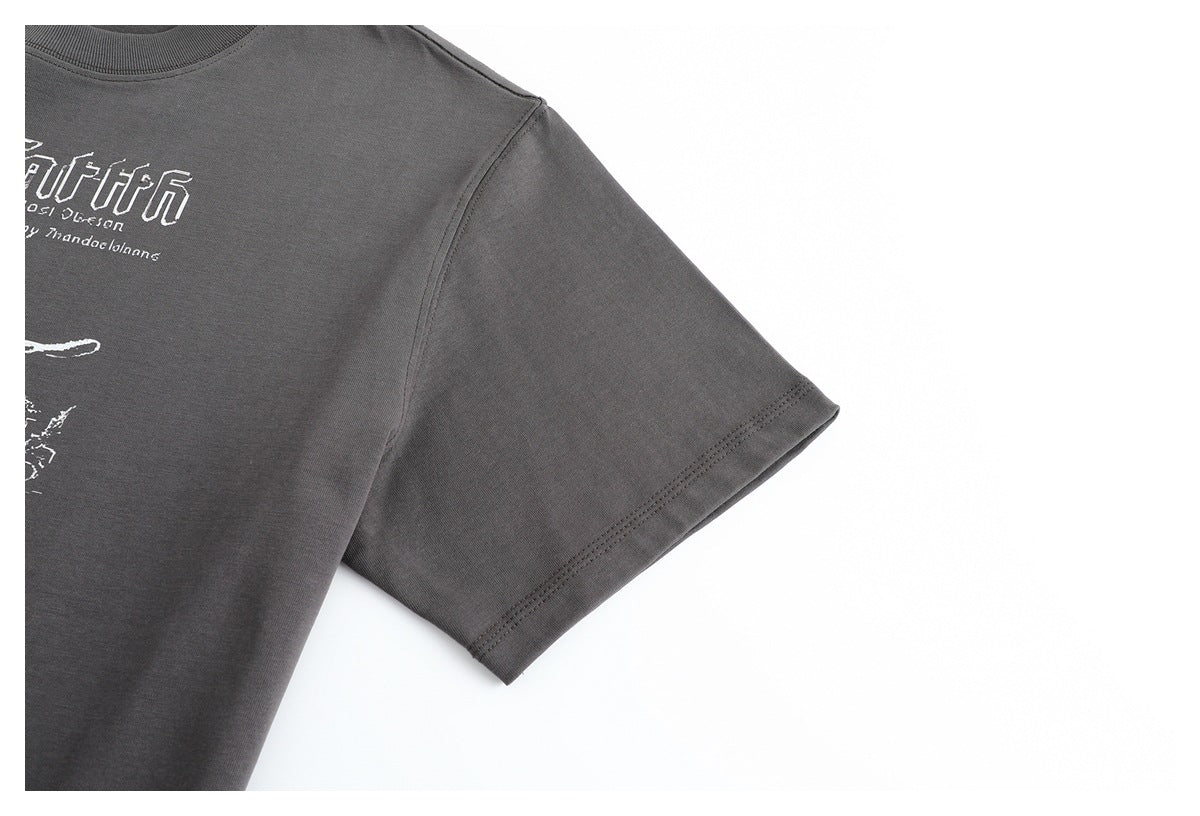 Close-up of the charcoal gray T-shirt's short sleeve and double-stitched cuff.
