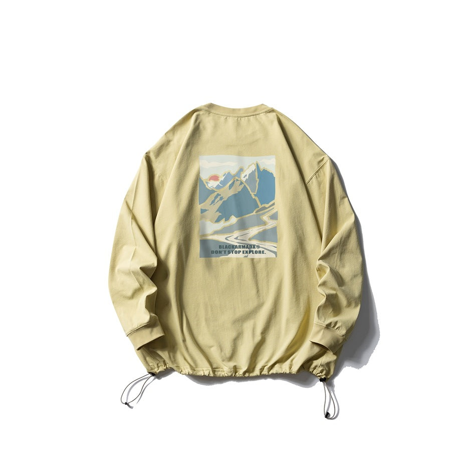 Pale yellow long-sleeve crewneck pullover with an adjustable drawcord hem and a colorful mountain graphic printed on the