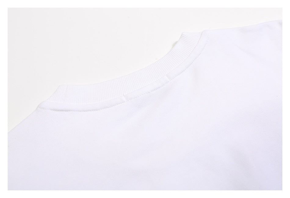 Close-up of the back neckline and shoulder area of a plain white sweatshirt.