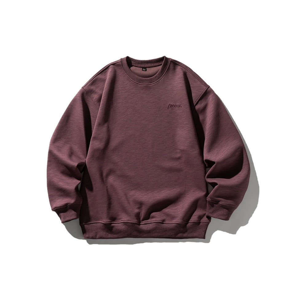 Burgundy crew neck sweatshirt flat lay, front view, with ribbed trim and small tonal chest embroidery