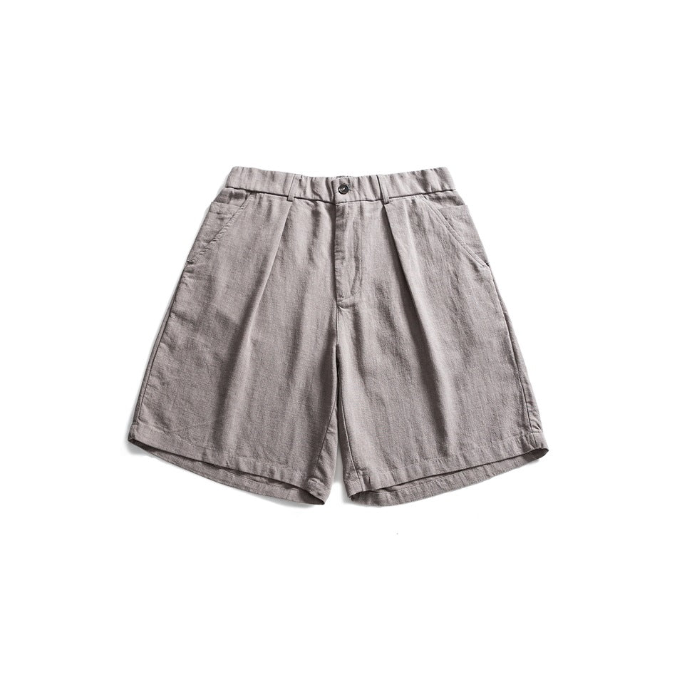 Gray pleated knee-length shorts with elastic waistband and button closure, flat lay front view