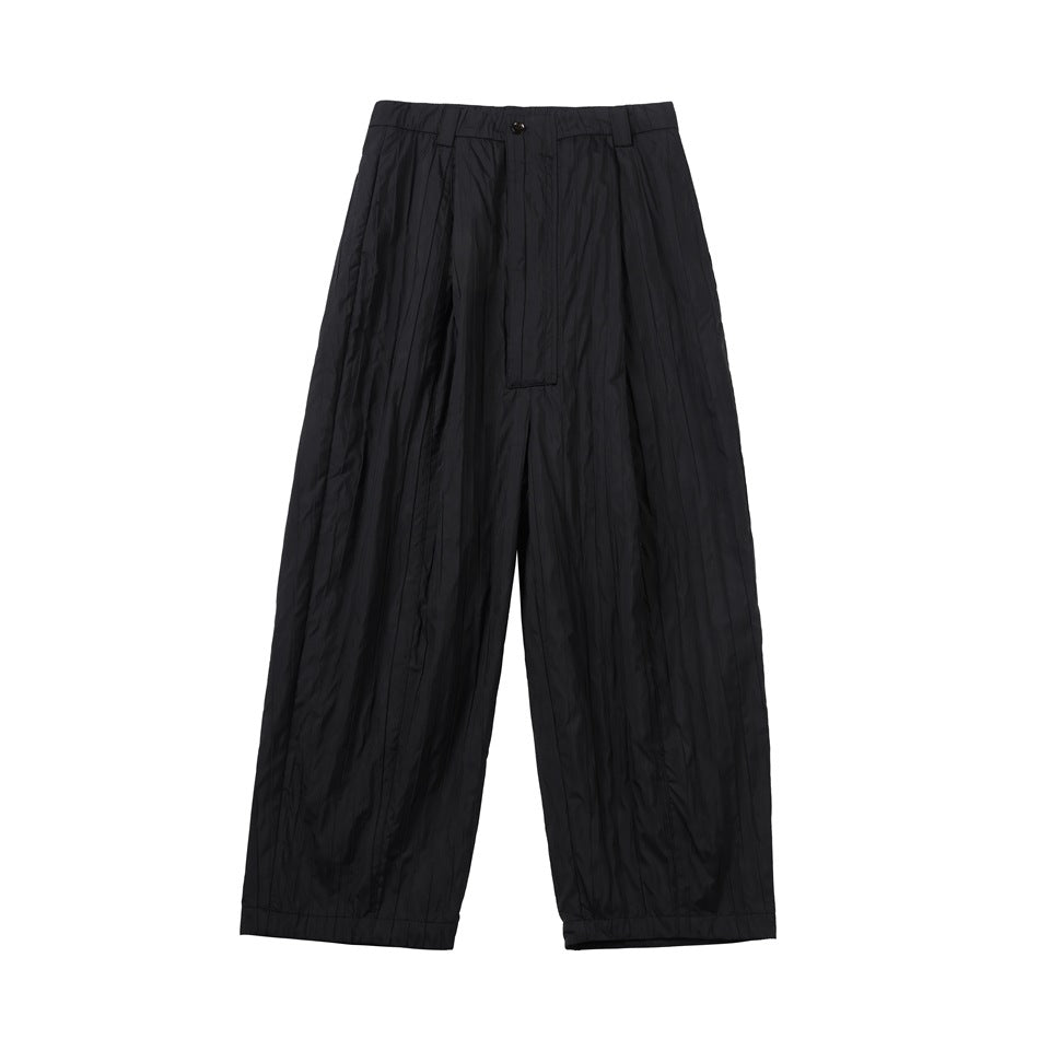 Black wide-leg pleated pants with crinkled vertical texture, button waistband and covered fly, front flat lay