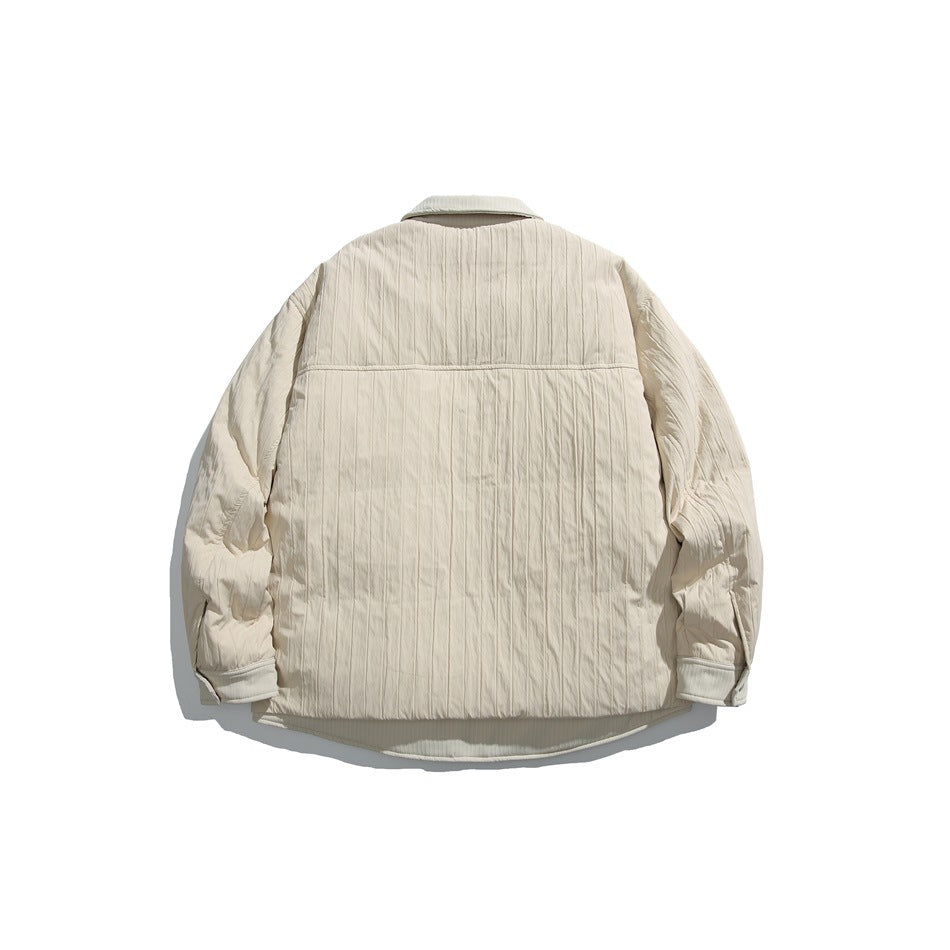 Back view of an ivory quilted jacket with long sleeves, a pointed collar, and a curved hem.