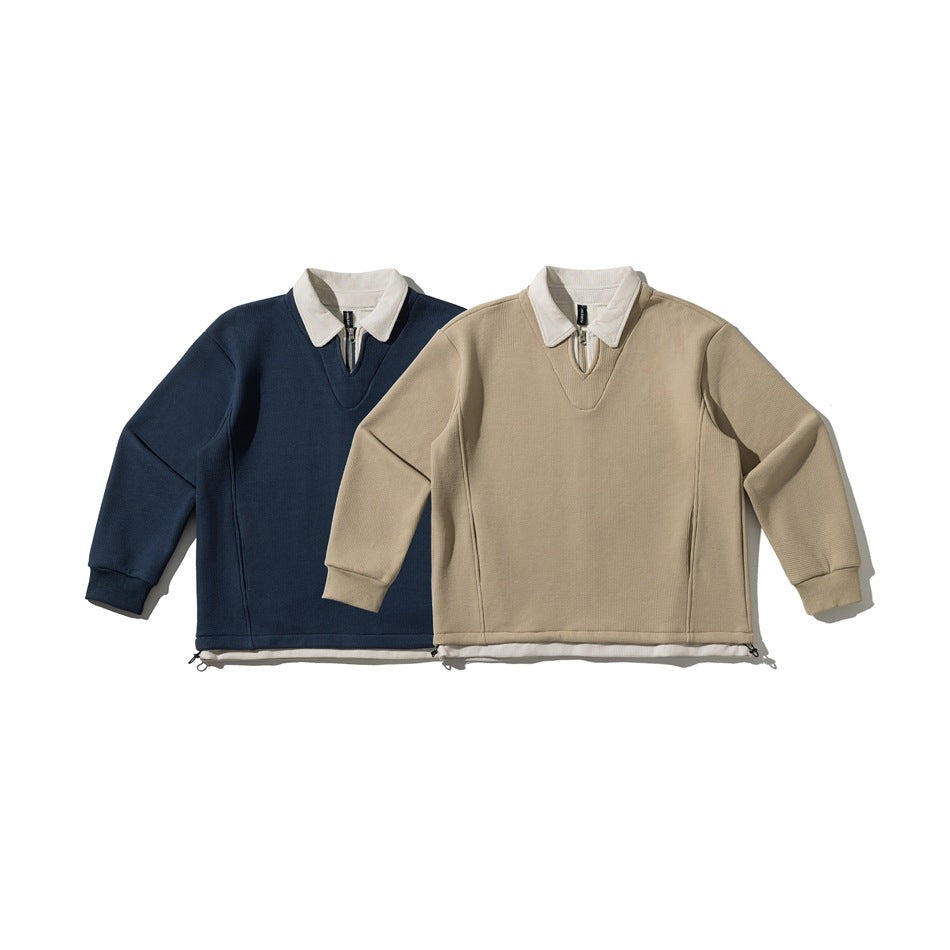 Two pullover colorways displayed side by side: navy and beige, each with a white collar and short zip placket.