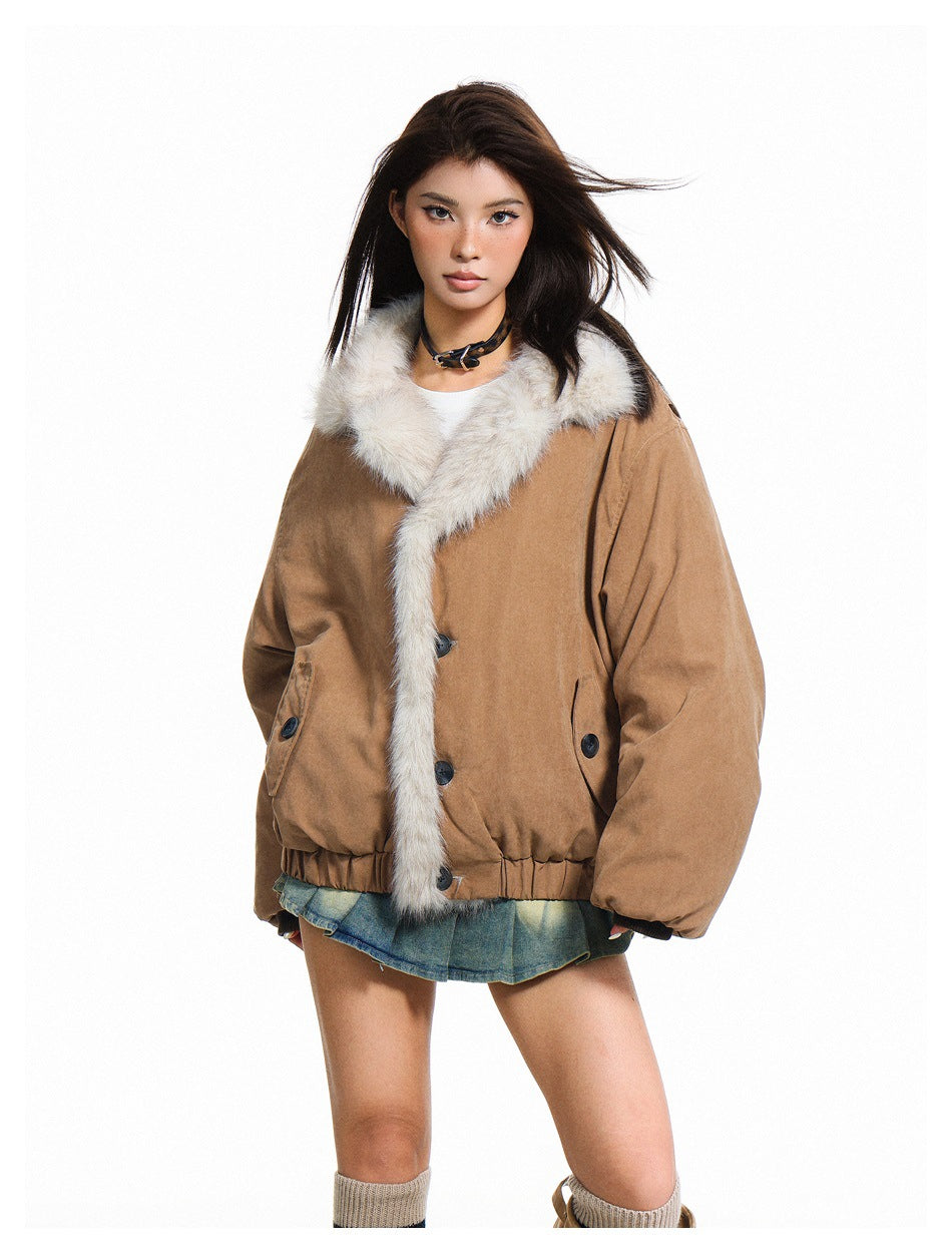 Front view of a model in a camel-brown jacket with a plush cream fur collar and long fur-trimmed front edge.