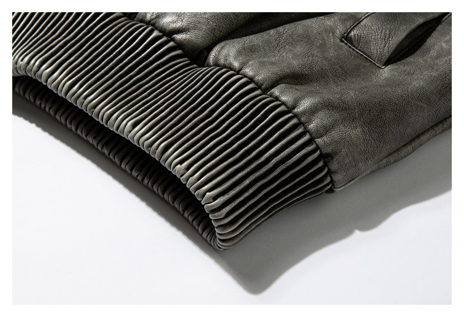 Close-up of the jacket's wide ribbed hem and textured body.