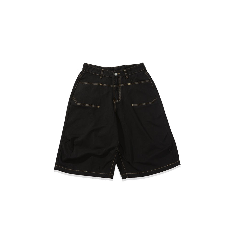 Front view of black wide-leg knee-length shorts with contrast stitching, belt loops, and angled front pockets.