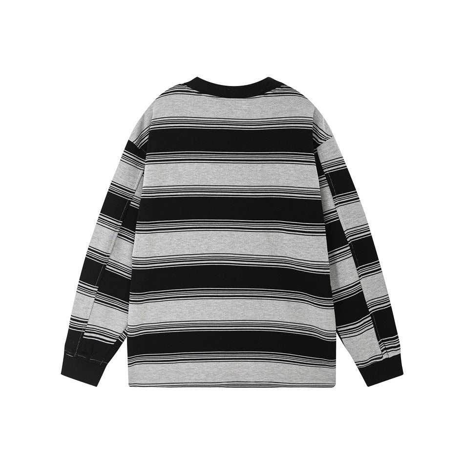 Back of a flat-lay long-sleeve shirt with broad black and light gray horizontal stripes and black ribbed trim.