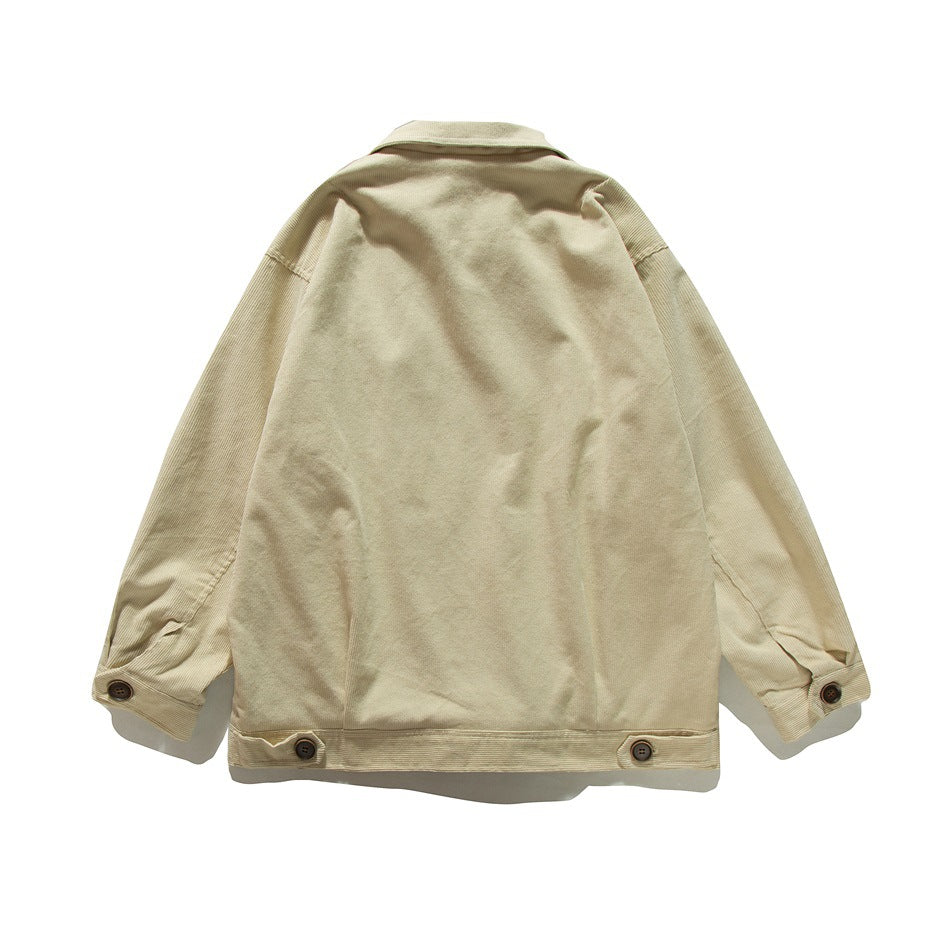 Back view of beige corduroy jacket with button cuffs and button tabs at the hem