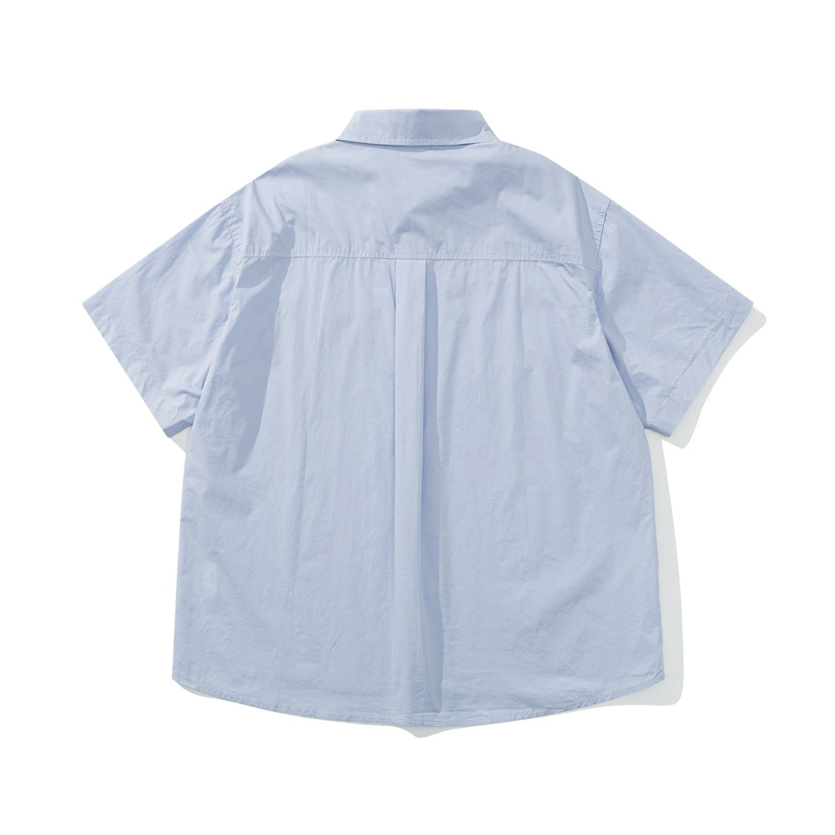 Back view of a pale blue short-sleeve button-up shirt with a back yoke and center pleat.