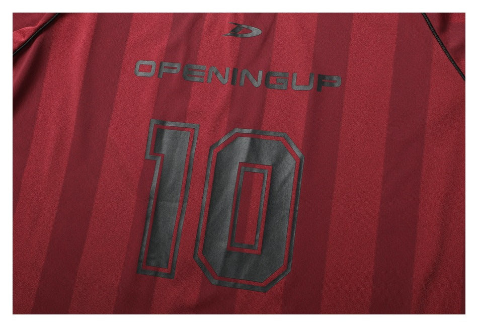 Close-up of the jersey's burgundy striped front with black lettering and a large number 10.