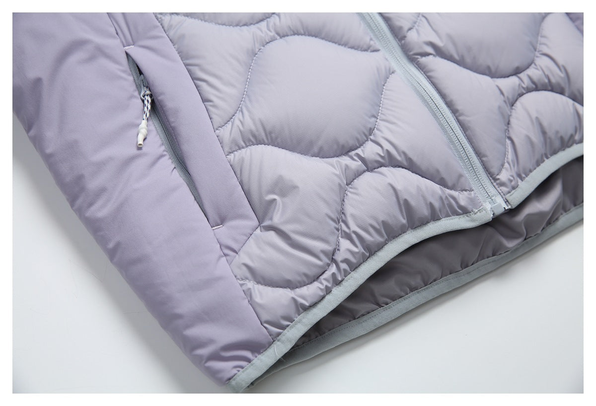 Close-up of the lavender jacket's zippered side pocket, front zipper, quilted hem, and gray trim.