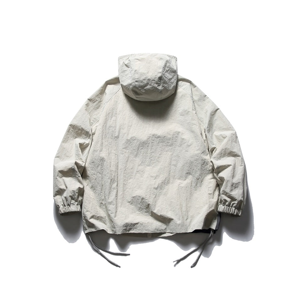 Back view of an off-white hooded jacket with elastic cuffs and adjustable drawcords at the hem.